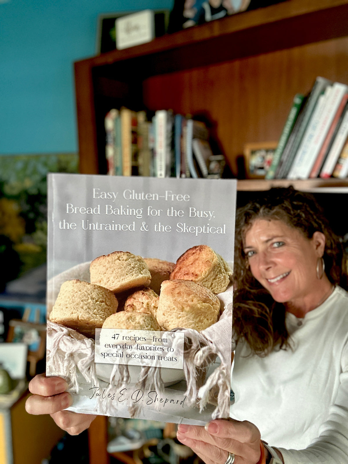 photo of author Jules Shepard holding Easy Gluten Free Bread Baking for the Busy, the Untrained, and the Skeptical (cookbook)