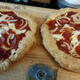 Customer photos of gluten free cheese and pepperoni pizzas made from gfJules gluten free pizza crust mix
